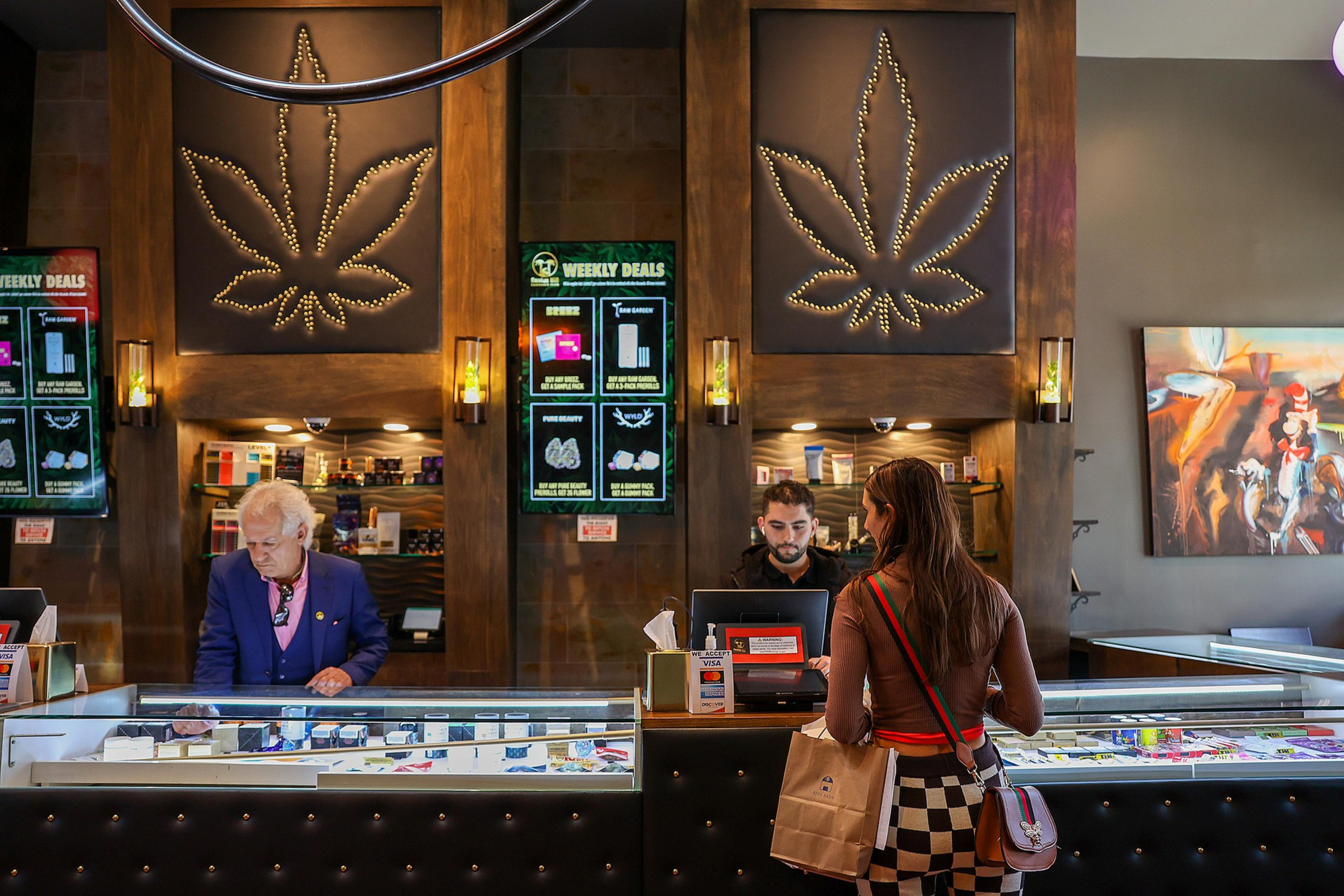 Interior of a cannabis café with ambient lighting and seating